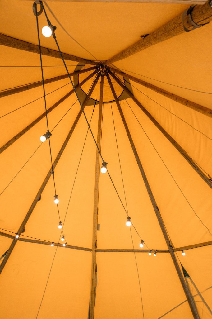tipi peak with festoon lights